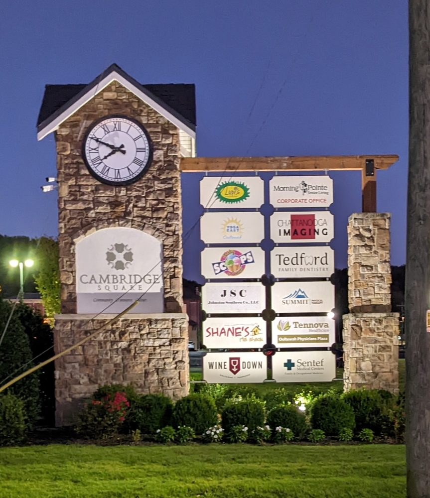 Cambridge Square entrance sign and clock tower in Ooltewah, Tennessee, featuring local businesses, shopping, and dining.