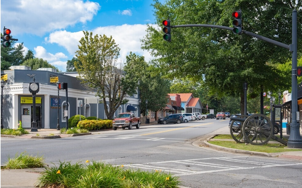 Historic downtown Chickamauga, Georgia, featuring local shops, tree-lined streets, and a Civil War cannon.